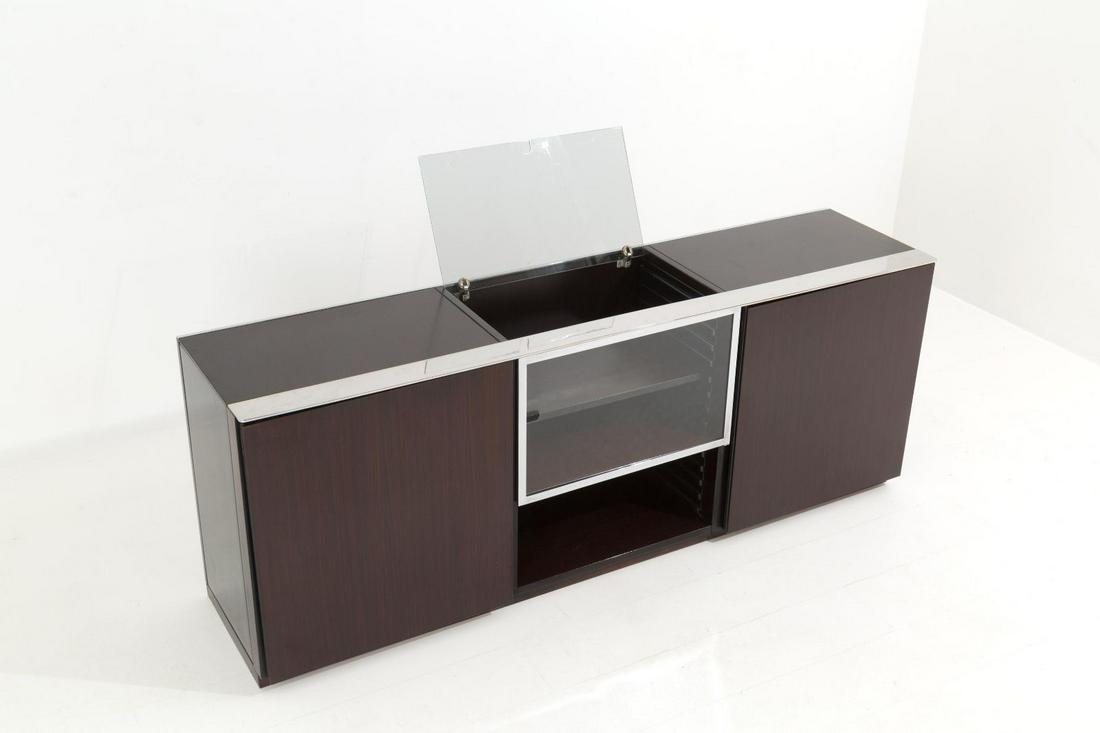 Center Sideboard in wood, chromed steel and glass: Length cm. 188 Height cm. 70 Depth cm. 45 ca. Center sideboard in wood, black stained wood, chromed steel and glass. Italian manufacture. 70's.