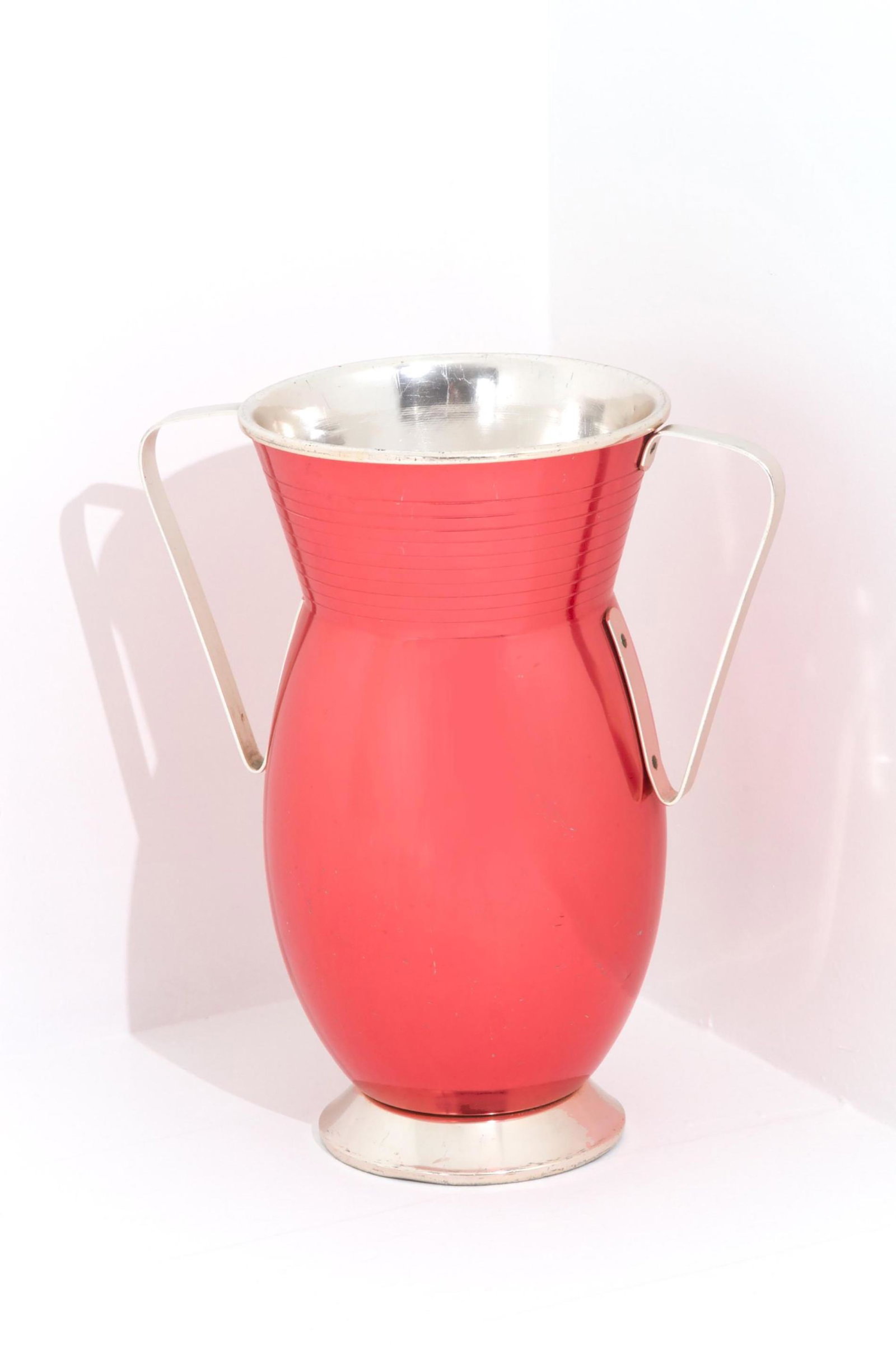 Umbrella stand Ettore Sottsass 1950: Length cm. 46 H. cm. 50 Diam. cm. 28 ca Cup shaped umbrella stand in chrome plated metal painted red. Mark on bottom. Rinnovel production.