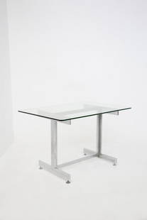 Vittorio Introini    ( - )    Steel and glass desk by Vittorio Introini from Vips Residence: Height: 74 cm Width: 120 cm Depth: 80 cm Italian handcrafted glass and metal desk by Vittorio Introini from the 1970s from Vips Residence. The desk has a rectangular shape. The top of the desk is made