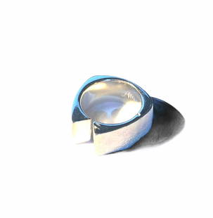 Silver ring by Angelo Mangiarotti: 925 rhodium-plated silver Stamped marks. 2005Italian size 10, European size 50, American size 5.25.