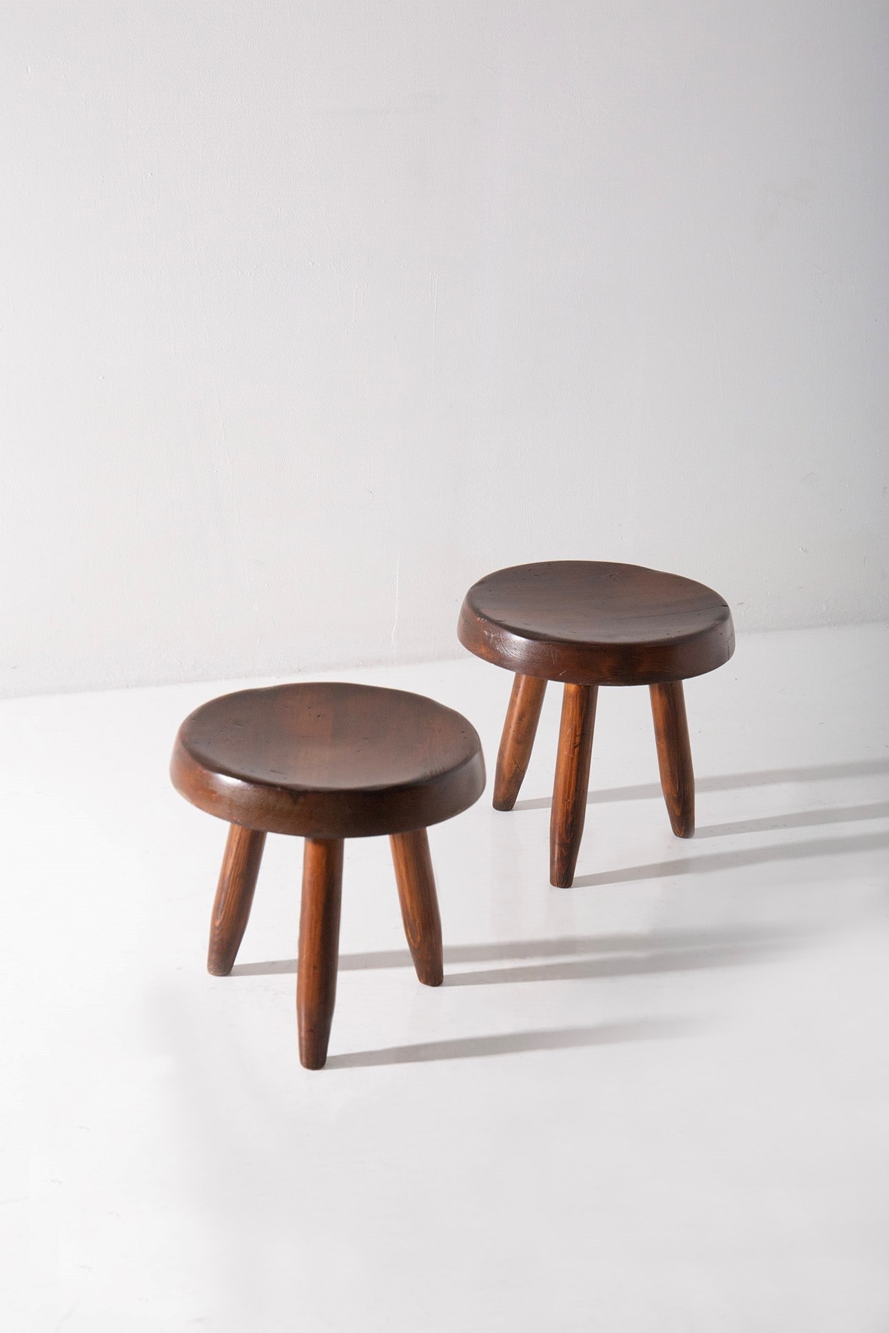 Pair of Charlotte Perriand Attr. dark stools (1 of 3)