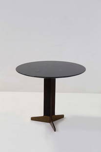 Ignazio Gardella    Round table: Height: 68 cm Diameter: 80 cmRound centre table with black marble top. Painted iron frame and brass feet.