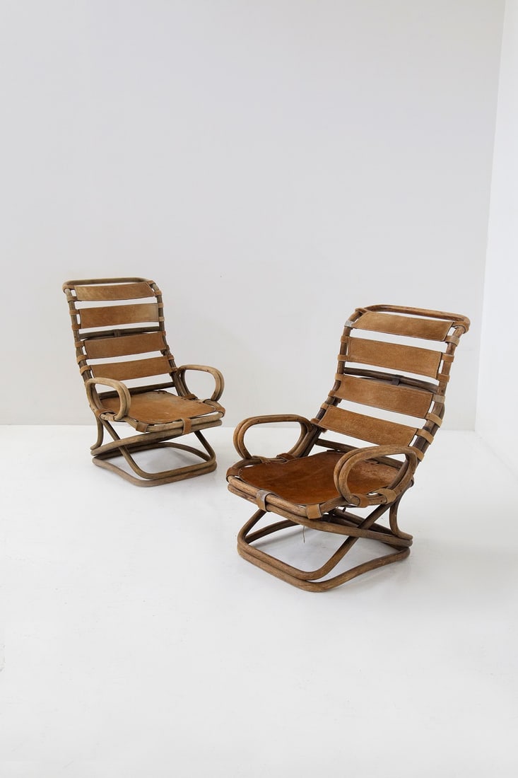 Tito Agnoli Bamboo armchairs in pony: Height 100 cm x Width 66 cm x Deep 80 cm This pair of armchairs has been handcrafted with high quality natural materials and has a surprising design! The whole structure is in rattan wicker while its