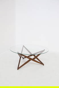 Angelo Ostuni Coffee table: Height: 45 cm, Diameter 100 cm. Small table designed by Angelo Ostuni in the 1960s, of Italian manufacture. The top is round and made of glass, supported by a wooden frame, which creates a star shape.