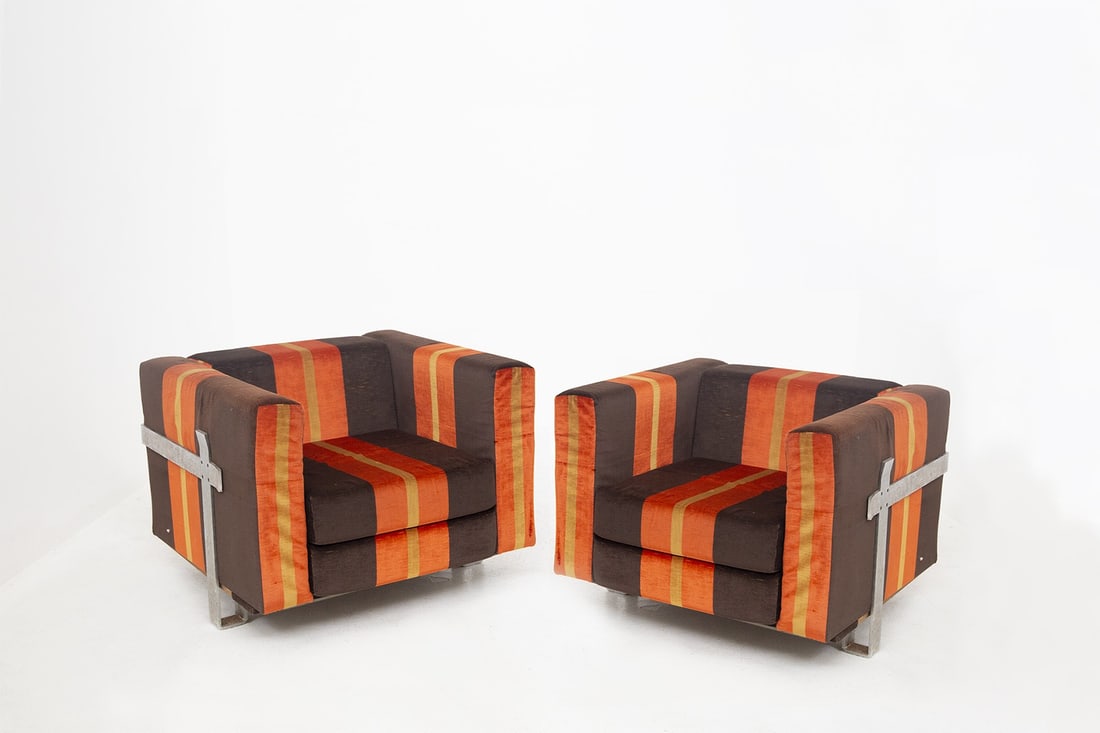 Kazuhide Takahama - Simon Gavina , Armchairs: height: 70 cm width: 88 cm depth: 86 cm seat height: 29 cmBeautiful pair of armchairs with anodized aluminum frame. Brown, orange and yellow striped fabric. The cushions serve as square armrests. Simo