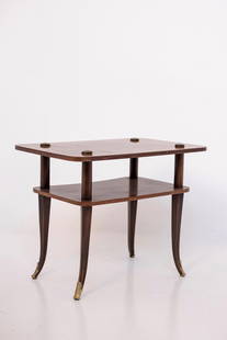 Manifattura Italiana    Vintage Italian coffee table: Height: 44 cm, Width: 66 cm Depth: 54 cmItalian wooden coffee table from the 1950s. The coffee table is made of wood and has a rectangular shape. With shelf. The feet of the coffee table have brass fe