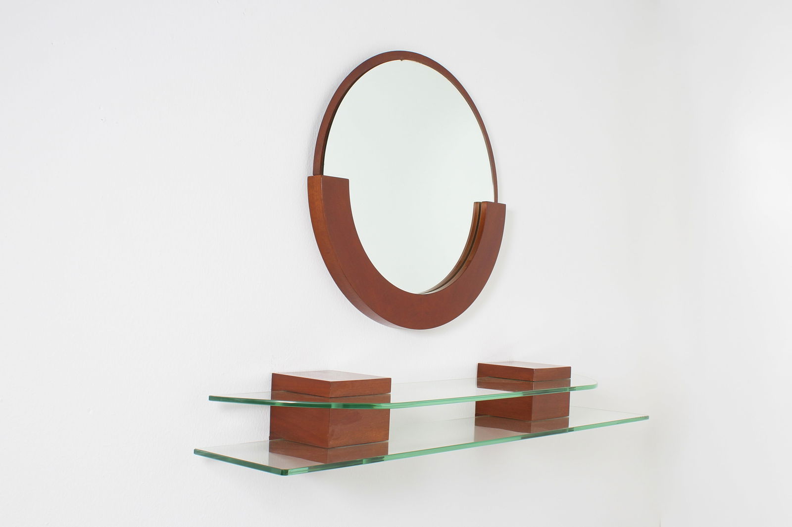Manifattura Italiana Console table with mirror: 4 cm x 60 cm diameter (mirror) 120 cm x 27 cm x 16 cm (console) Console table with mirror, made of thick glass and wood. Italian production, 1970s.