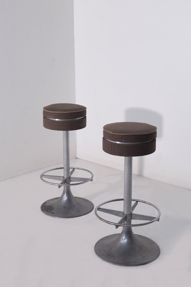 Fendi Pair of stools: Height: 80.5 cm, Diameter: 41 cm Pair of 1960s metal stools manufactured by Metal Mobili Arredo with FENDI fabric.
