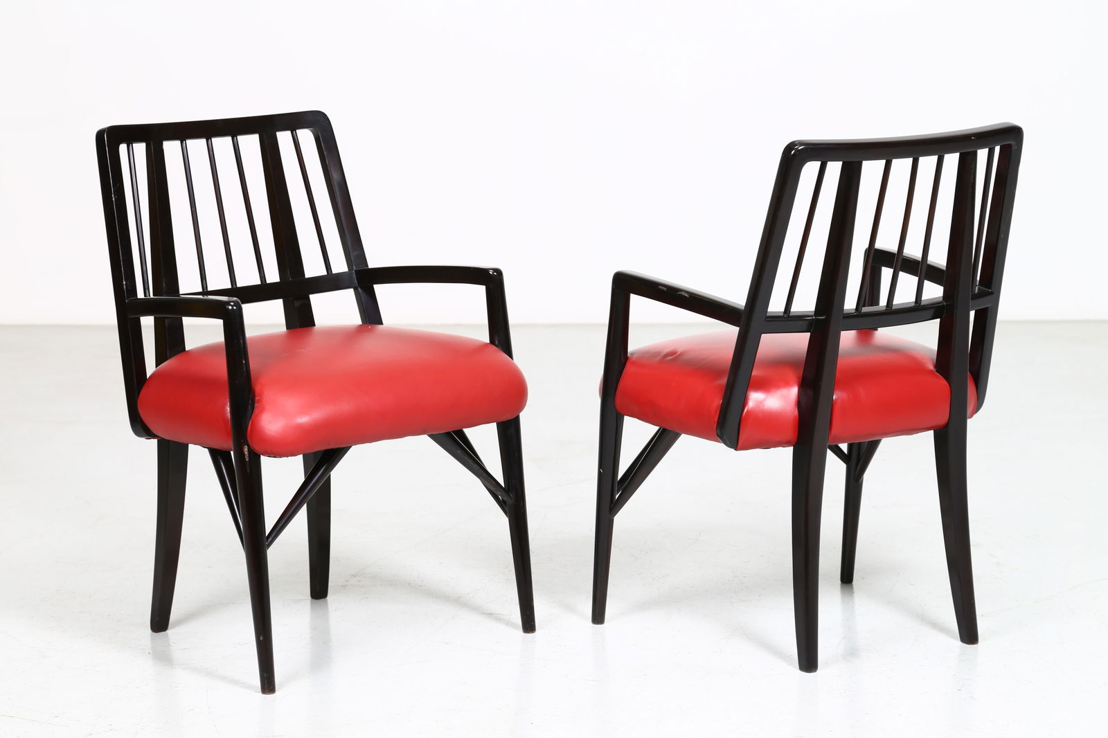 Paul Laszlo Set of Four Chairs: Height: 81 cm Width: 53 cm Depth: 53 cm Seat Height: 43 cm The set of vintage chair by the designer are from the 50s by Paul Laszlo . Elegantly finished in black lacquered wood, they are characterised