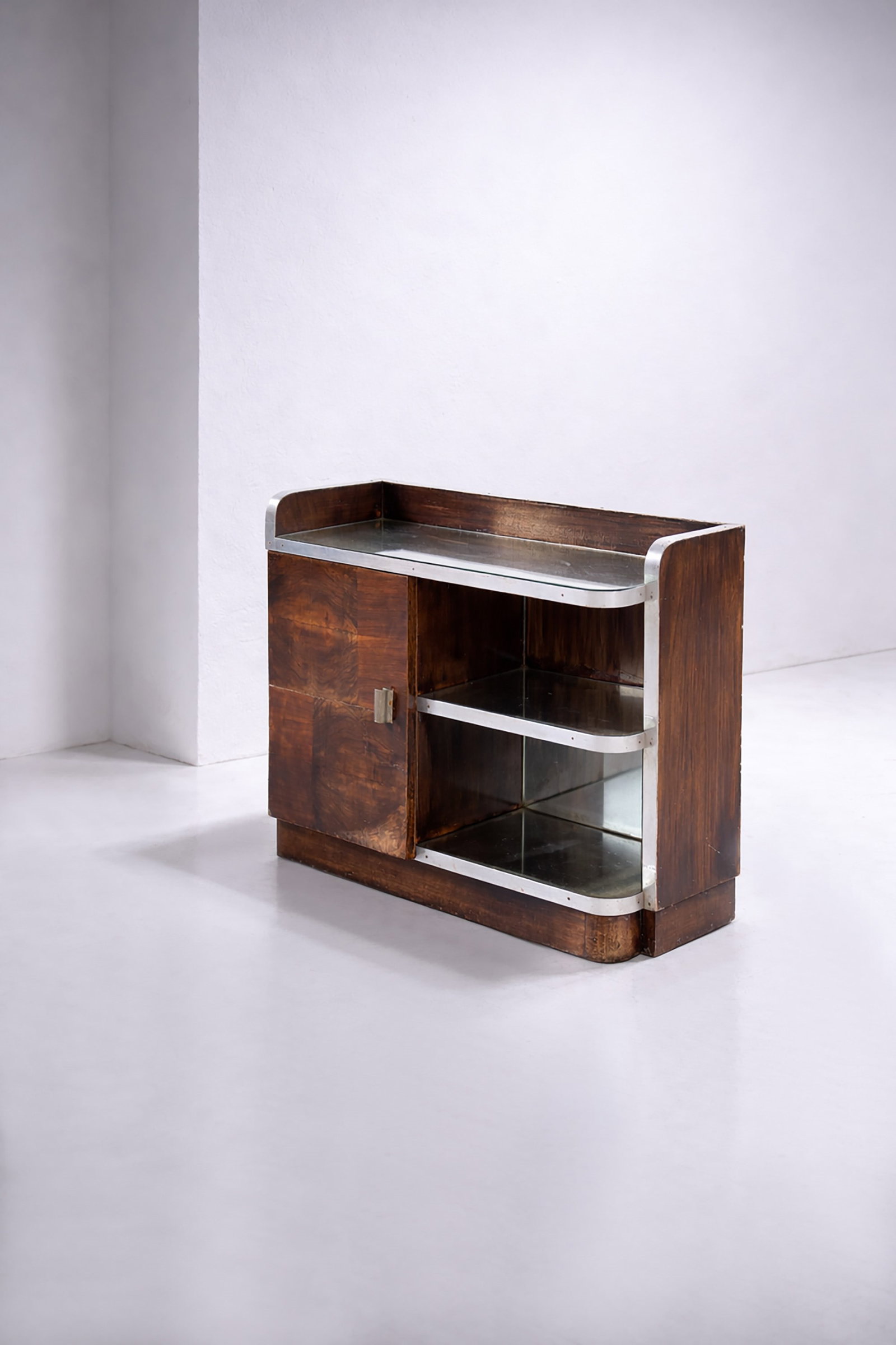 Manifattura Italiana Small bar cabinet: Height: 75 cm Width:80 cm Depth: 37 cm Small 1930s Italian rationalist bar cabinet. With metal inserts and glass top.