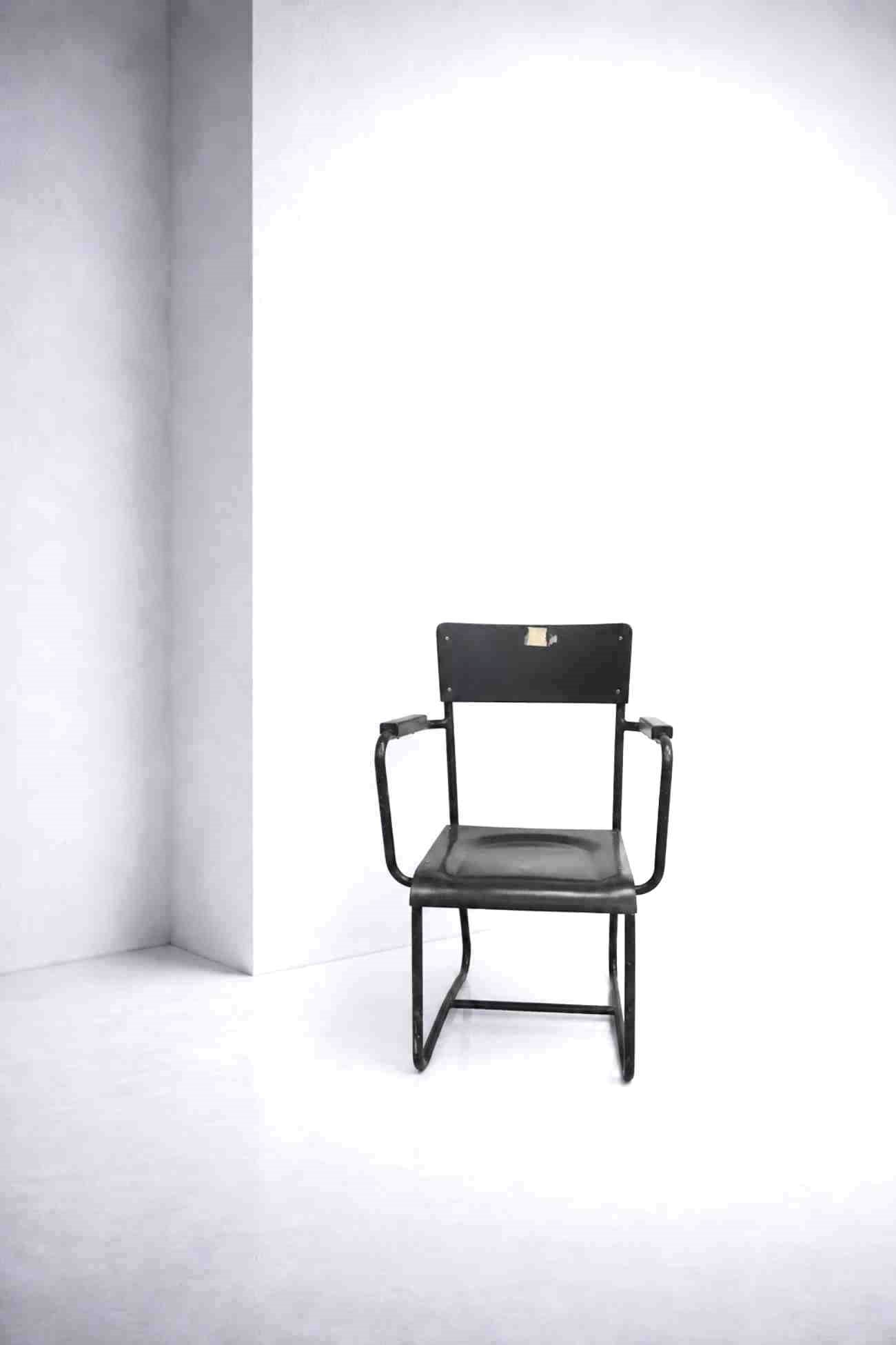 Paul Schuitema Office Chair: Height: 86 cm Width: 54.5 cm Depth: 54 cm Armchair attributed to Paul Schuitema, 1930s, made of tubular metal with armrests and black-lacquered wood.