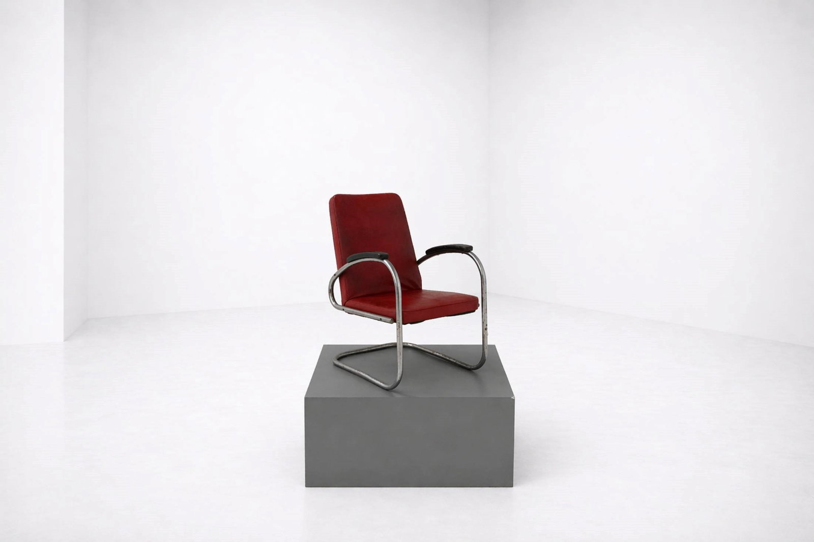 Mauser Werke Armchairs RS7: Height 89 cm, Depth 71 cm, Width 53 cm RS 7 armchair from the Bauhaus period, manufactured by Mauser Werke. The seat and backrest are upholstered in dark red faux leather, while the armrests are made