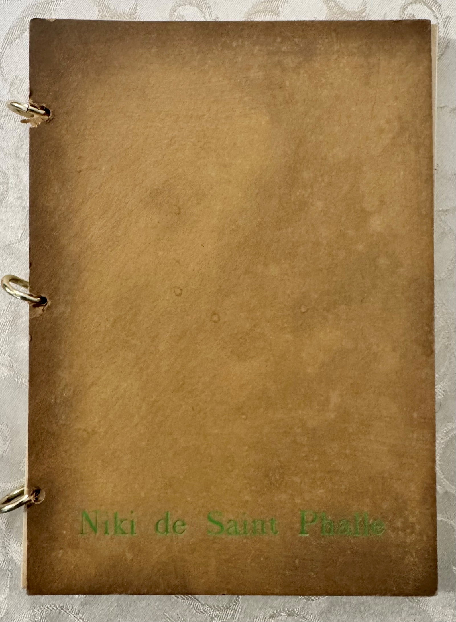 Niki de Saint Phalle: Rare artist's book by Niki de Saint Phalle (1930-2002), central figure of Nouveau R?alisme and creator of the iconic 'Nanas'. The copy features a sand-colored suede leather cover with the artist's