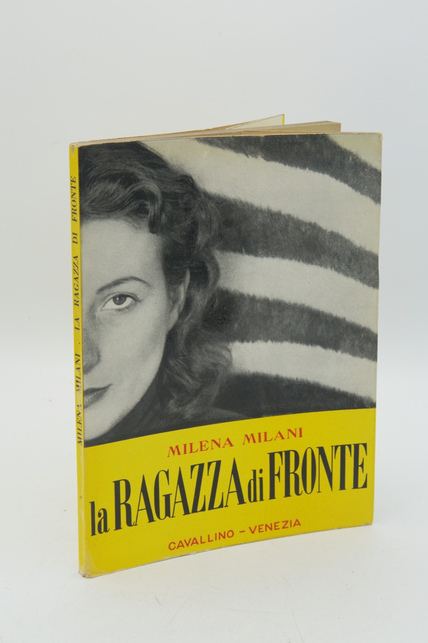 The Girl Opposite: MILENA MILANI. The Girl Opposite. Venice, Edizioni del Cavallino, December 1953. 8vo, illustrated publisher's wrappers with extraordinary color photographic cover. FIRST EDITION, COPY NUMBER 1 of