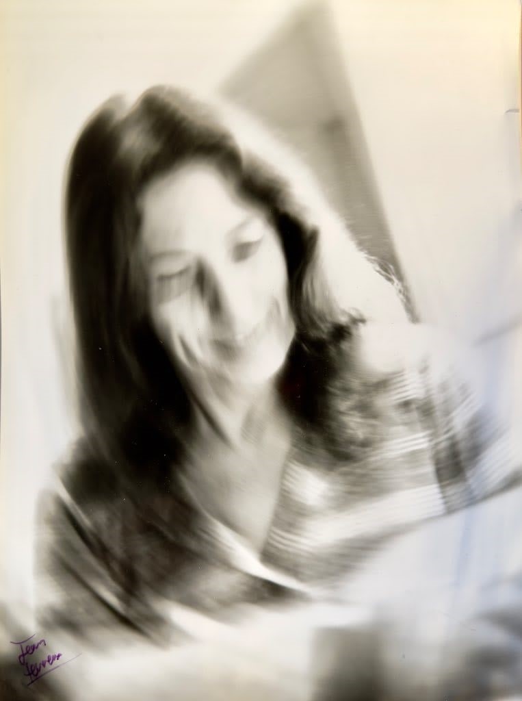 Jean Ferrero - Photographic portrait by Milena Milani: Milena Milani Portrait in Motion by Jean Ferrero, vintage gelatin silver print from the Seventies. The image captures a woman with long dark hair in a moment of spontaneous movement, with the
