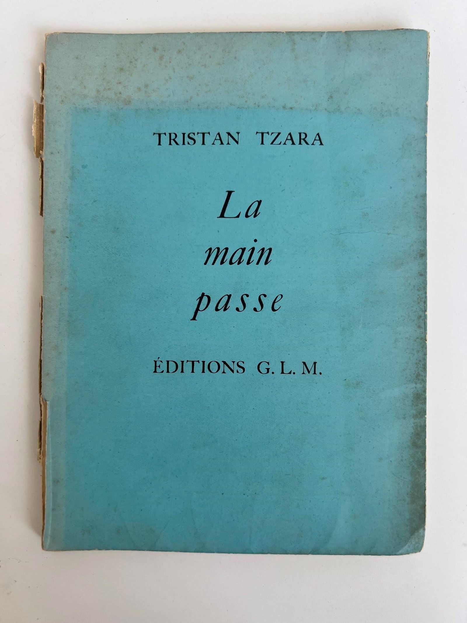La main passe BY Tristan Tzara: First edition of La main passe by Tristan Tzara, published by Editions G.L.M. in 1935. This is a rare work, often numbered, printed in a limited run (usually 300 copies) on vellum paper. The volume