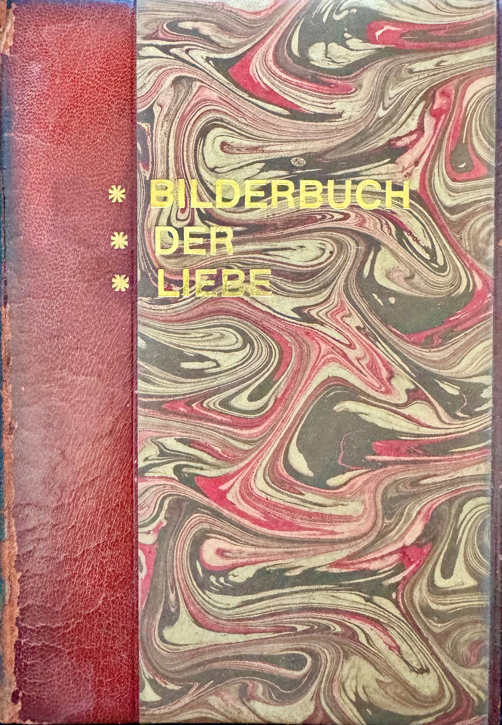 Bilderbuch der Liebe: BILDERBUCH DER LIEBE. Der Gigantische Erfolg. Berlin, Kultur-Verlag G.m.b.H., [circa 1920]. Octavo volume, contemporary half-red leather binding with boards covered in elegant comb-marbled paper in