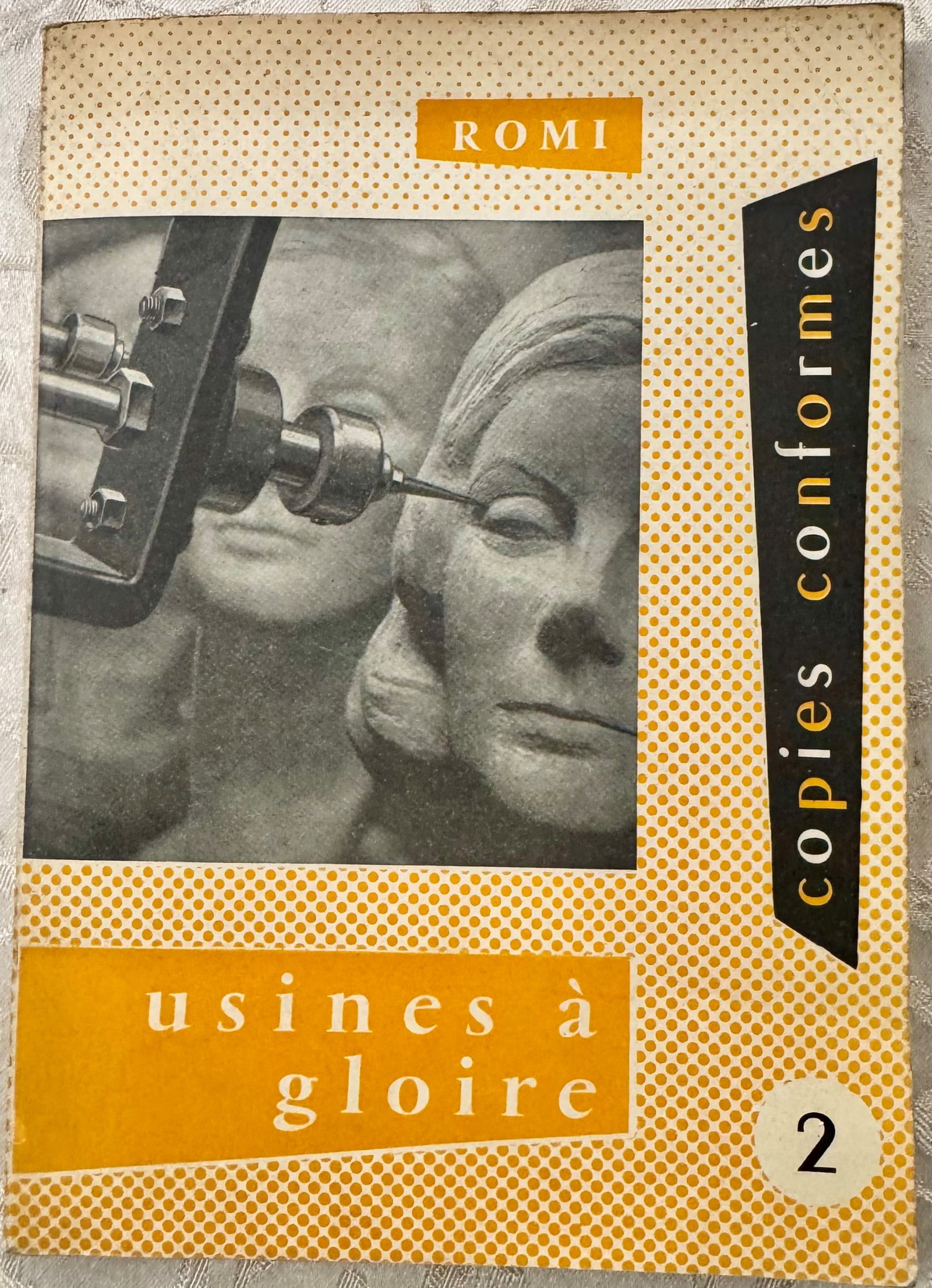 Factories of Glory: ROMI. Factories of Glory. Paris, Editions de Paris, 1953. 8vo, illustrated publisher's wrappers with Surrealist photomontage depicting mannequin heads and mechanical instrumentation, typical 1950s