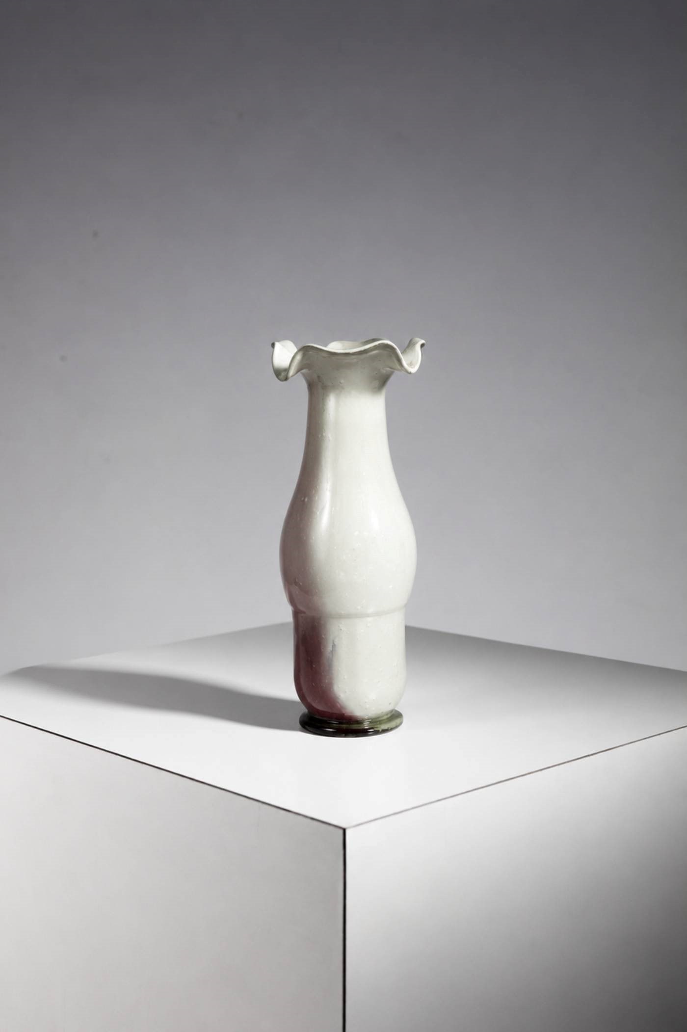 Manifattura Italiana Artistic Vase: Diameter 11 cm, Hight 29 cmArtistic Murano glass vase from the 1960s_1970s. The vase has two different sides: one is white, and the other is colored on the back.