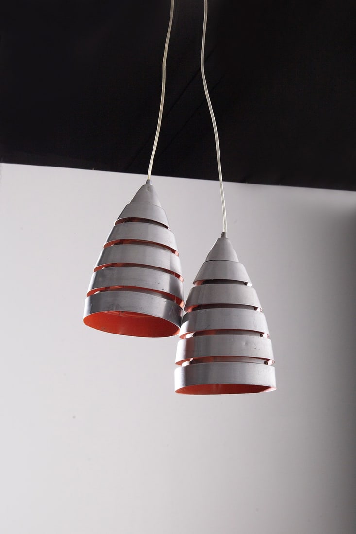 Manifattura Italiana Pair of pendants red: Height: 80 cm, Diameter 17 cm.Pair of pendants with aluminum light covers and red painted interior. 80s-90s years old