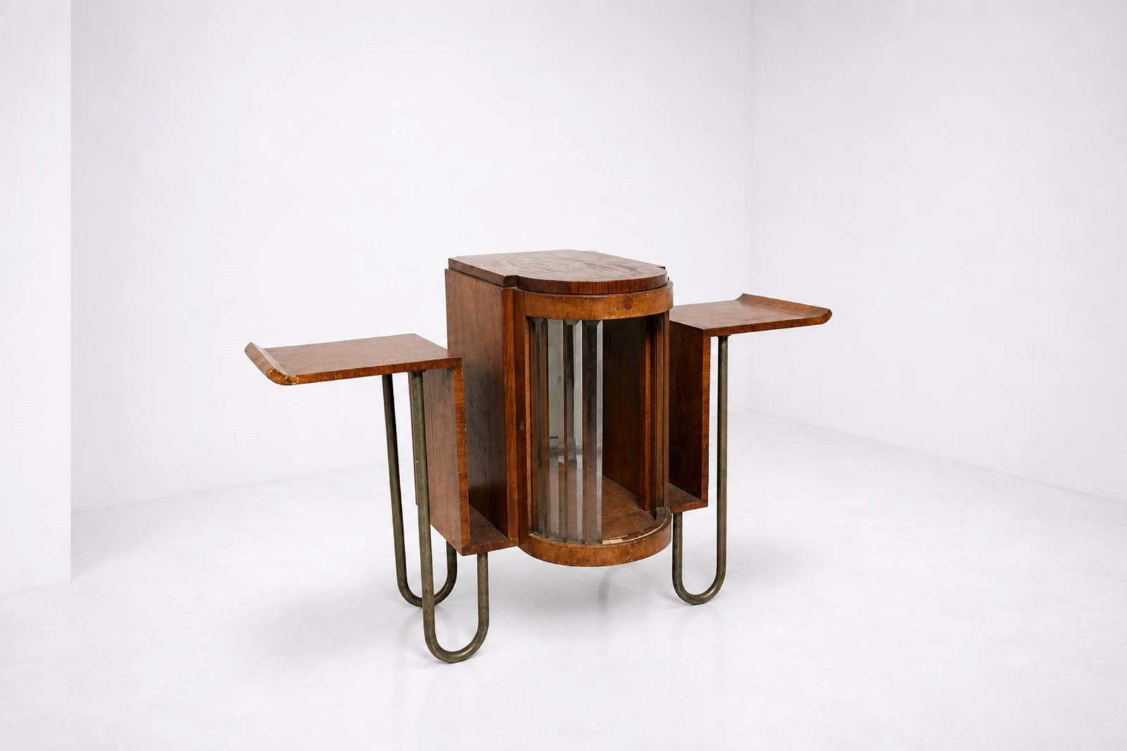 Manifattura Italiana Bar cabinet: Italian rationalist bar cabinet made of wood with tubular metal legs. Features glass panels. There are also two magazine holders on the sides.