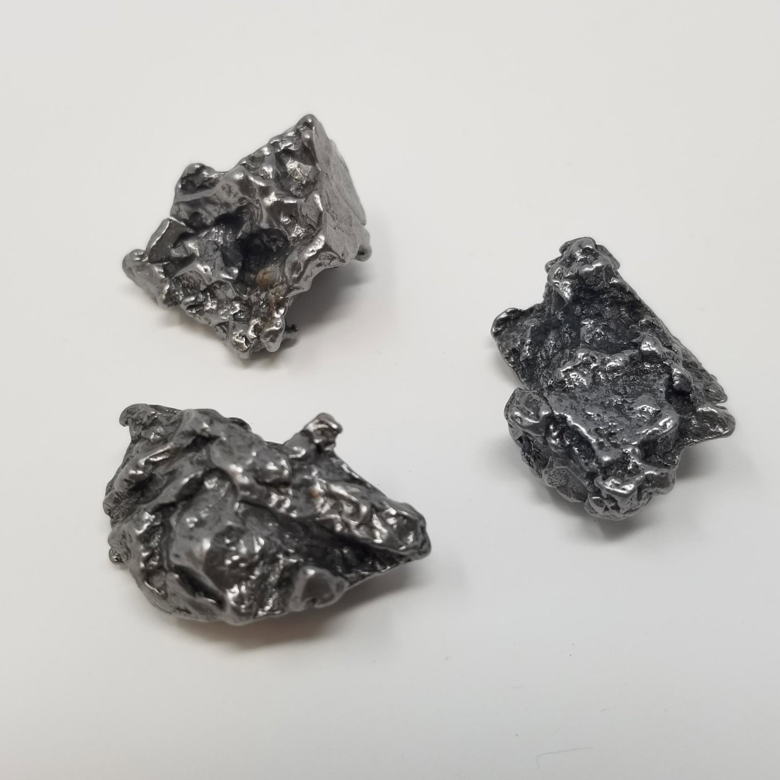 Campo Meteorite Lot (3): 3 Small Campo del Cielo Meteorites, about 80 grams total. From Argentina. Fell over 4000 years ago. Primarily iron, shiny well preserved sample. Provenance - ex. IMCA dealer, USA All purchases will be
