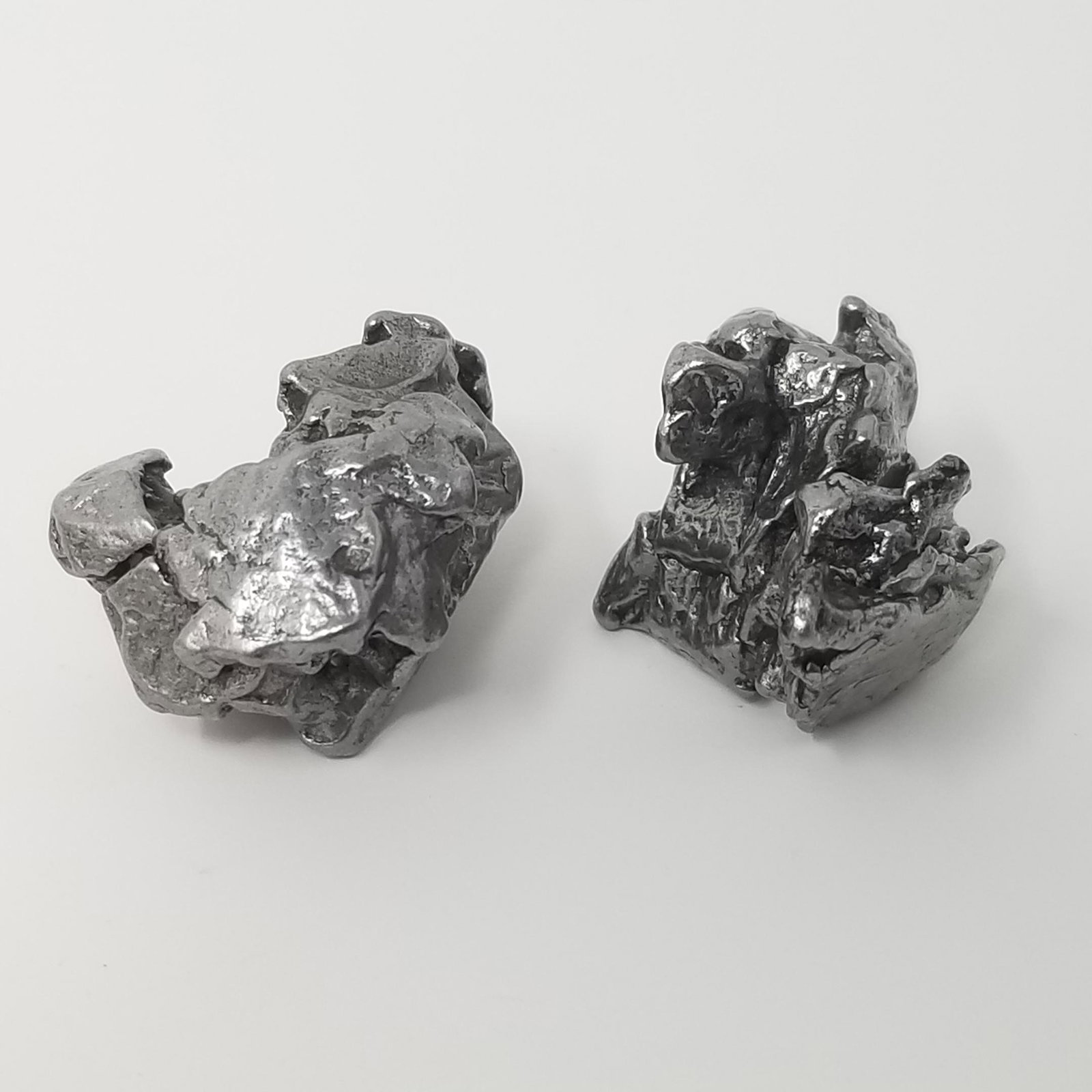 Campo del Cielo Meteorite (2): Description: 2 small Campo del Cielo Meteorites, see picture. 25 grams+ Provenance: ex. IMCA dealer, USA All purchases will be accompanied by a signed Certificate of Authenticity. Items sold by Pax Hi