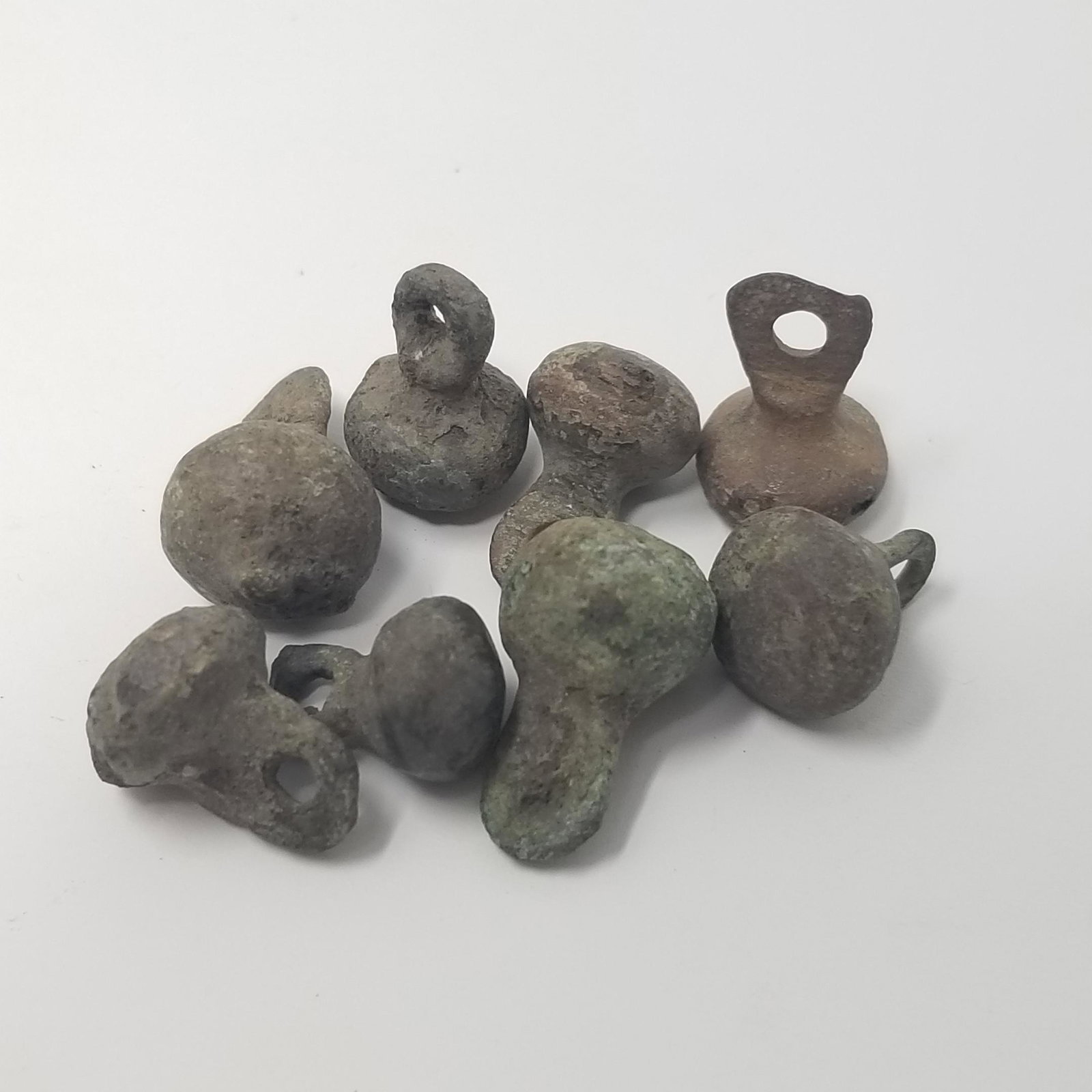 Viking Bronze Buttons (8): From the Norse culture, 10th Century CE. 8 Small bronze buttons from the coat of a Viking! Great for jewellery. Provenance - ex. California, USA collection All purchases will be accompanied by a signe