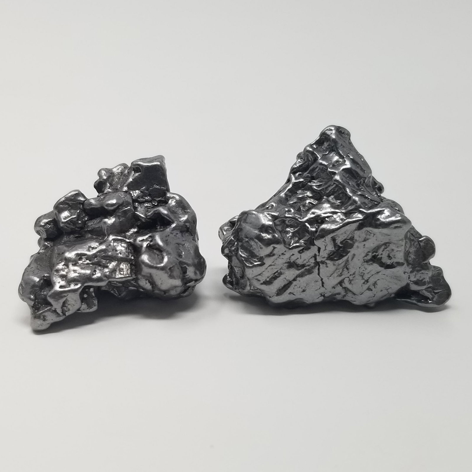 Campo del Cielo Meteorite (2): Description: 2 small Campo del Cielo Meteorites, see picture. 25 grams+ Provenance: ex. IMCA dealer, USA All purchases will be accompanied by a signed Certificate of Authenticity. Items sold by Pax Hi