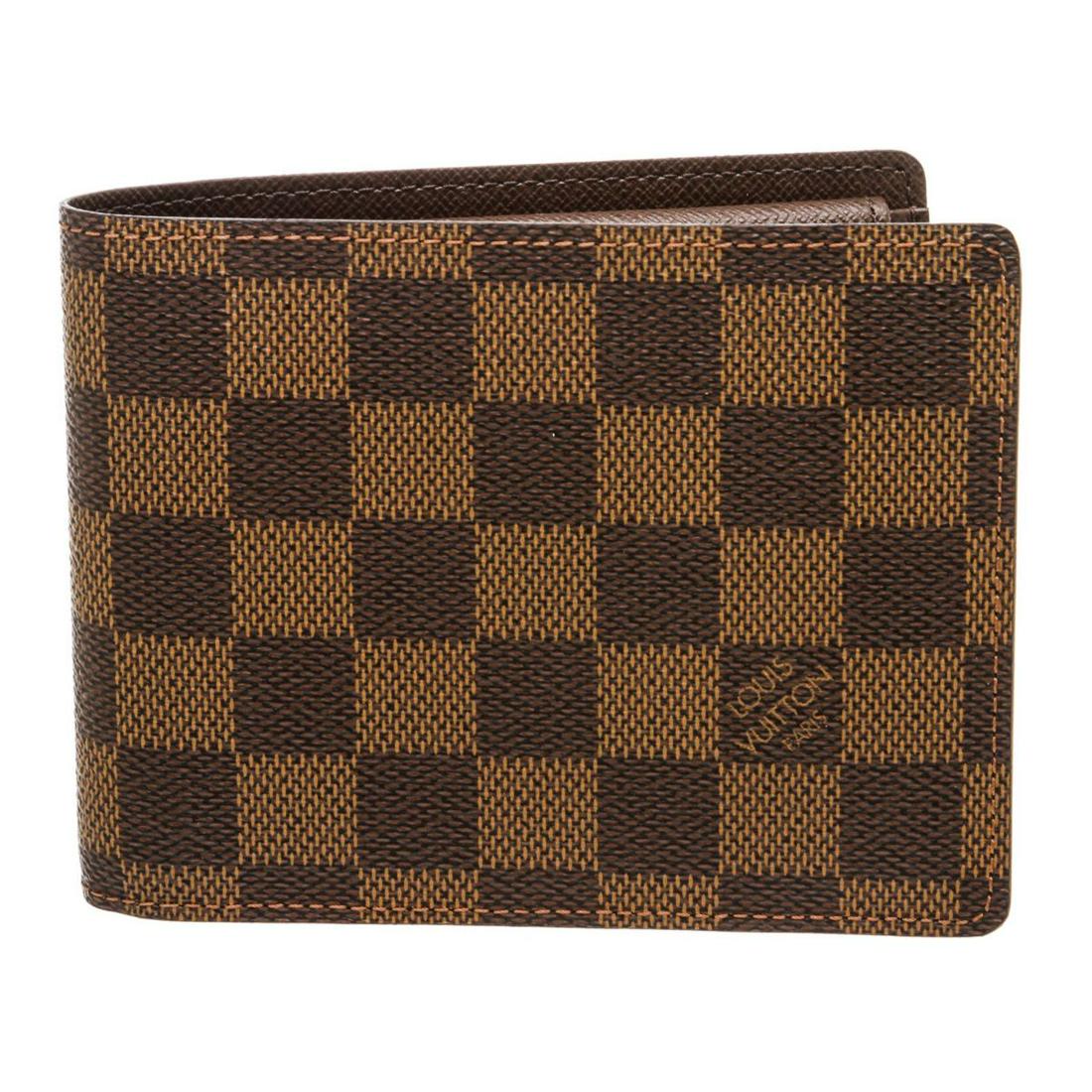 Louis Vuitton Damier Ebene Wallet: Brand : Louis Vuitton Style: Damier Ebene Canvas Leather Portefeuille Florin Wallet DETAILS Crafted out of Damier Ebene brown coated canvas and bi-fold flap closure. Inner eight credit card slots, one