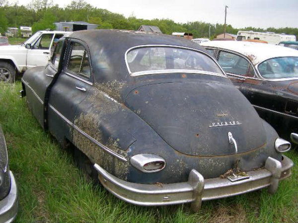 1949 Packard 4dr Sedan Club Sedan: This is a 1949 Packard 4dr Sedan. It is a Club Sedan. The car is complete and thrim is decent. It is a 3 speed on the column. It is a in-line 8 cylinder motor. It has a bench seat and the interior is