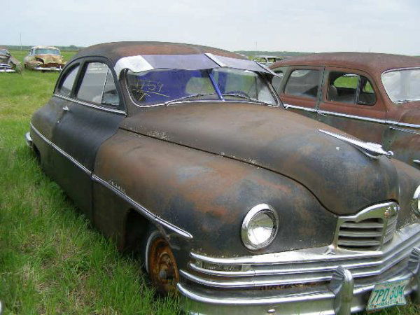 1949 Packard 2dr Club Sedan: This is a 1949 Packard 2dr Sedan. It is a Club Sedan. The car is complete and thrim is decent. It is a 3 speed on the column. It is a in-line 8 cylinder motor. It has a bench seat and the interior is