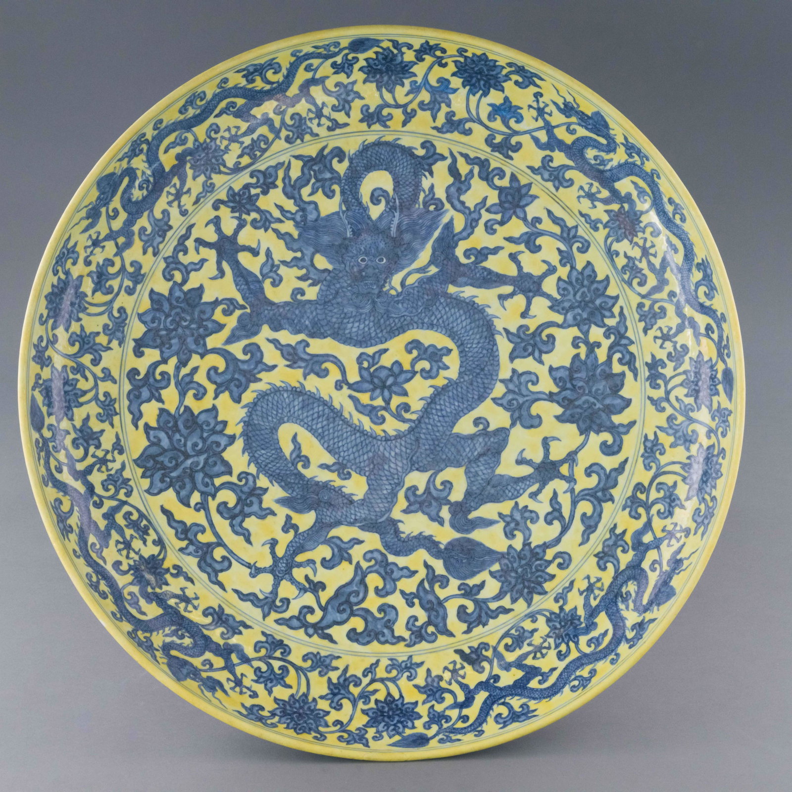 JIAJING BLUE DRAGON FAILLE JAUNE PLATE: Dimensions: Height: 3.25 inch x Width/Diameter: 23.25 inch x Length/Depth: 23.25 inch Dimensions in Centimeter: 8.3 cm x 59.1 cm x 59.1 cm Very Rare, Extraordinary, 15th C. Chinese Ming Dynasty Period