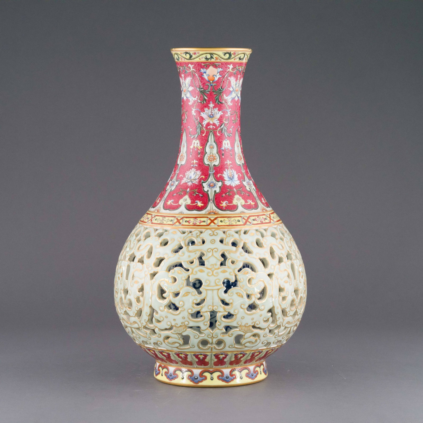QIANLONG PIERCED FAMILLE ROSE BOTTLE VASE: Dimensions: Height: 16.125 inch x Width/Diameter: 8.625 inch x Length/Depth: 8.625 inch Dimensions in Centimeter: 41 cm x 21.9 cm x 21.9 cm Chinese Qing Dynasty Qianlong rococo vase. Porcelain potted 