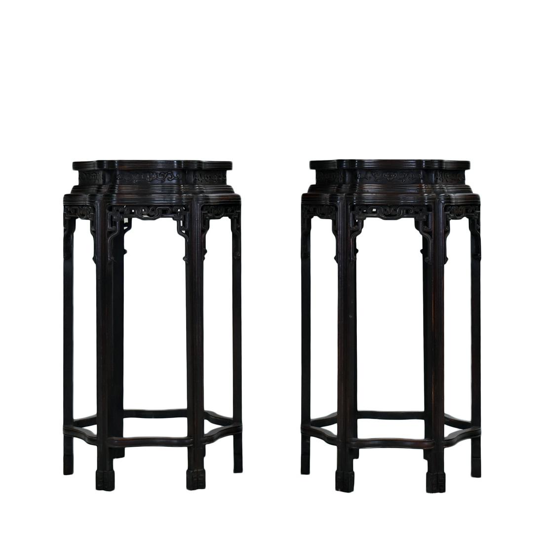 19TH C PAIR OF ZITAN HEXAGONAL FLORI-FORM STANDS: Dimensions: 37-1/2" H x 19" W 19th Century Pair of Chinese Zitan Plant stands. A Hexagonal flori-form petal shaped flat top, with grooved rim, above shaped apron with rococo motif reliefs; surmounted 