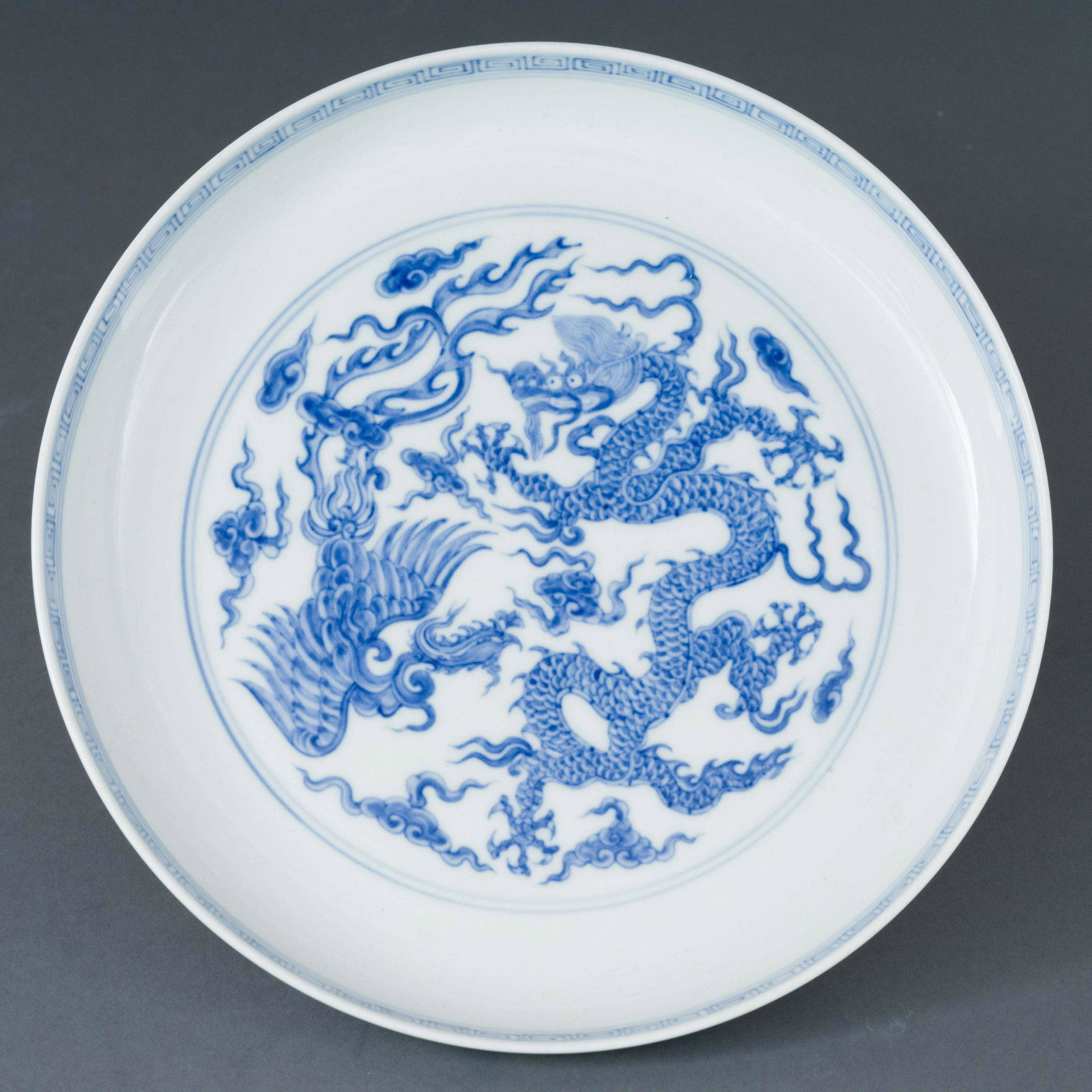MING CHENGHUA BLUE & WHITE DRAGON PHOENIX PLATE: Dimensions: Height: 1.5 inch x Width/Diameter: 9.5 inch x Length/Depth: 9.5 inch Dimensions in Centimeter: 3.8 cm x 24.1 cm x 24.1 cm Chinese Ming Dynasty Chenghua blue and white dragon phoenix porcel