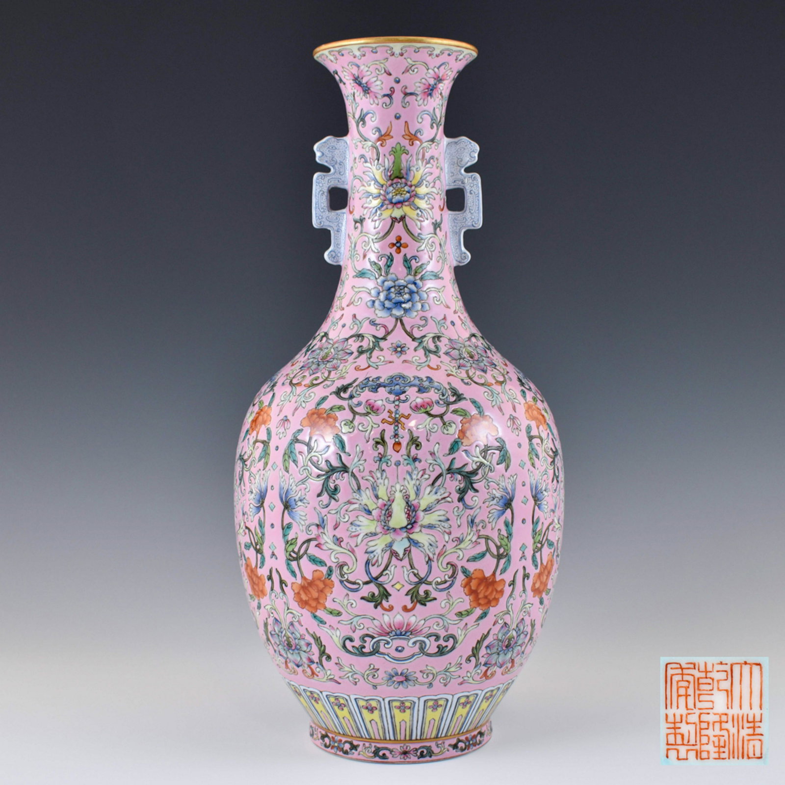 QIANLONG FAMILLE ROSE FLORAL AMPHORA VASE: Dimensions: Height: 13 1/2" Diameter: 6 1/2" Chinese rose floral amphora vase. Round bulbous form rising upward to a thin waisted neck with a trumpet-like rim. Pair of ear-shaped handles found flankin