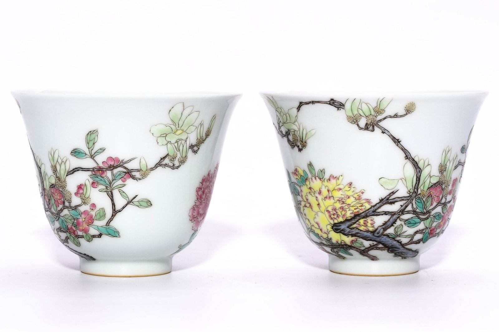 A PAIR OF CHINESE FAMILLE ROSE PORCELAIN CUPS: A Pair of Chinese Famille Rose Porcelain Cups. 清:雍正粉彩花卉杯一对 Dimensions: H 6.5cm, D 8cm PROVENANCE: Arlin Holmes (April 1951 - May 2