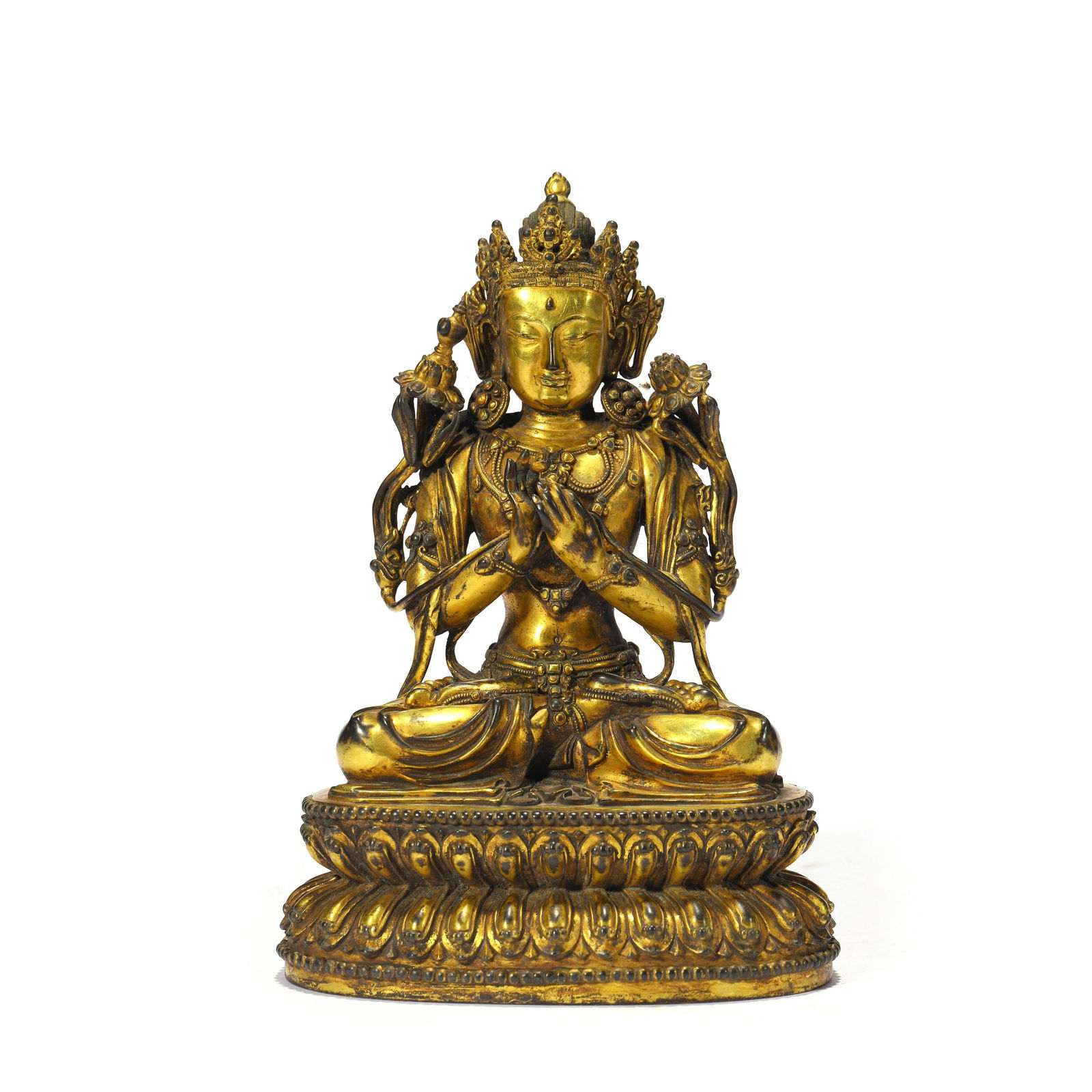 A Gilt-bronze Dipamkara: The deity seated on a double lotus base in dhyanasana, his hands hold in dharmacakra mudra, holding the stems of lotus, wearing loose flowing robes and elaborate beaded jewellery. She wears an adorned