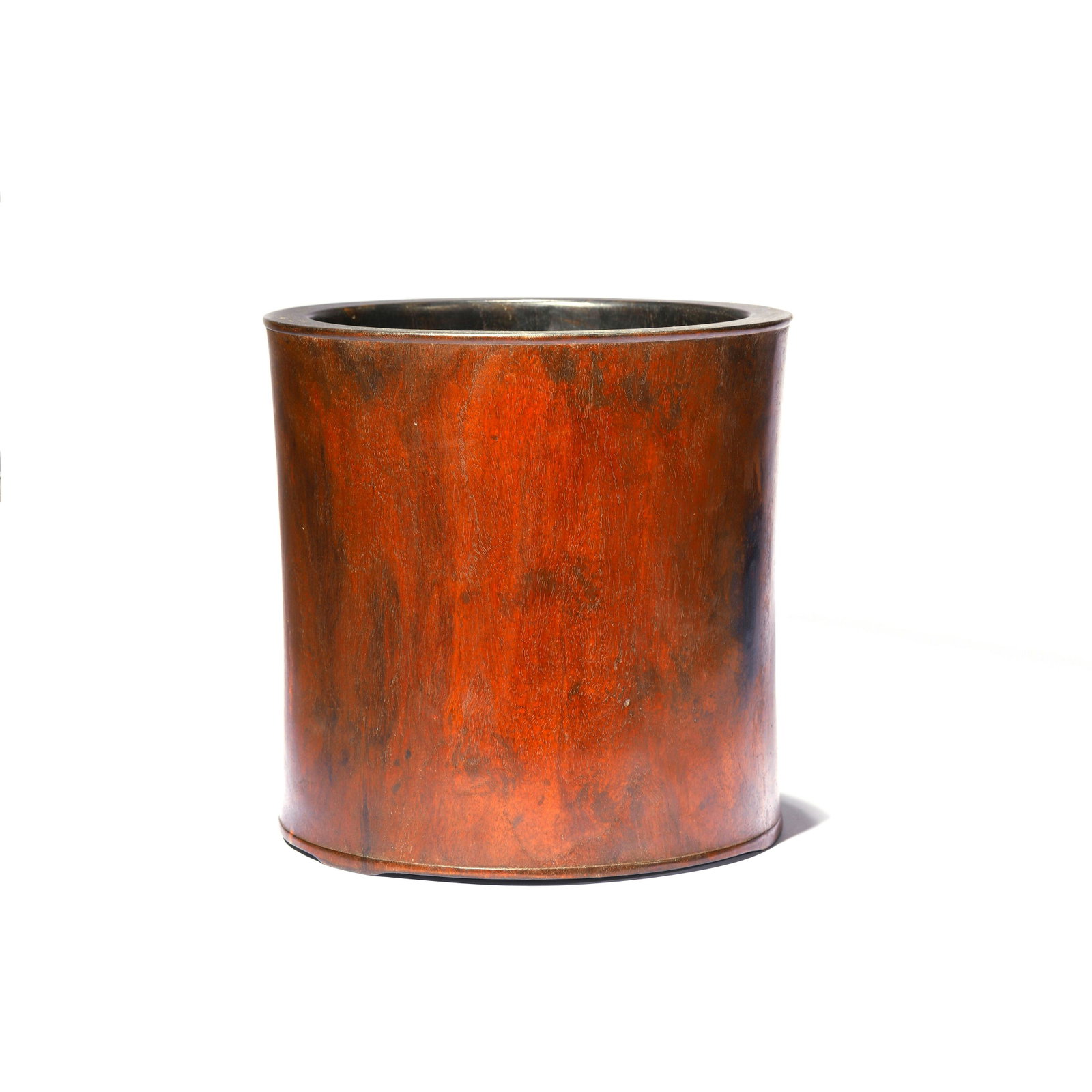 A Huanghuali Brush Pot: The huanghuali brush pot is finely carved in cylindrical form with bright golden-brown color evenly. Width: 26.5cm, Height: 26.5cm Over all in GOOD condition. ROSWELL AUCTIONS provides condition repor