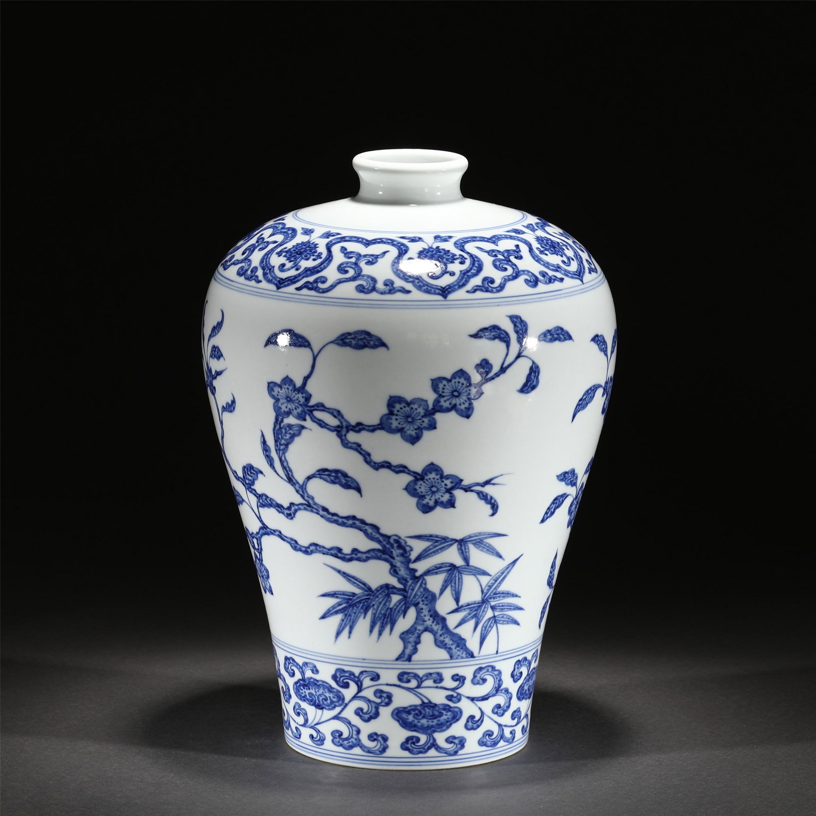 A BLUE AND WHITE PORCELAIN VASE/QING DYNASTY: A BLUE AND WHITE PORCELAIN VASE/QING DYNASTY 23 cm L x 35 cm W Rising from a slightly splayed foot to a high-shoulder body blow a short, waisted neck, painted in bamboo and bloom sprays all between fl