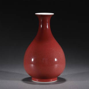 A RED GLAZE PORCELAIN VASE,QIANLONG: A RED GLAZE PORCELAIN VASE,QIANLONG 12 cm L x 11.5 cm W x 20 cm H x Weight 670 gram. With a tapering body rising to a round shoulder beneath a waisted neck and a slightly flared lipped rim,