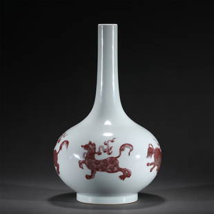 A RED UNDER GLAZE PORCELAIN VASE,YONGZHENG: A RED UNDER GLAZE PORCELAIN VASE,YONGZHENG 19 cm Diam x 32.6 cm H x Weight 1730 gram. Raising from a circular foot to a narrow neck, decorated with beasts in copper red.