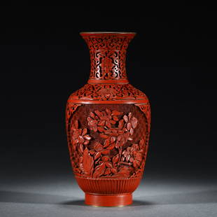 A CHINESE CARVED FLOWERS TIXI LACQUER VASE: A CHINESE CARVED FLOWERS TIXI LACQUER VASE 11x22 cm x Weight 520 gram. Carved cinnabar lacquer vase, each side carved in high relief with birds on branches, with blue interior.