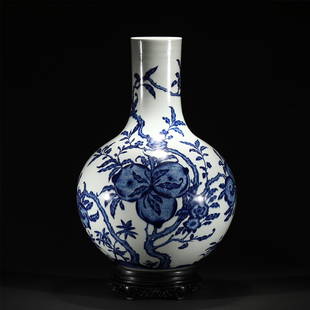 A BLUE AND WHITE PORCELAIN VASE /QING DYNASTY: A BLUE AND WHITE PORCELAIN VASE /QING DYNASTY 39 cm L x 62.4 cm H Raising from a circular foot to a straight neck, the globular body finely painted with peach branches in cobalt blue.