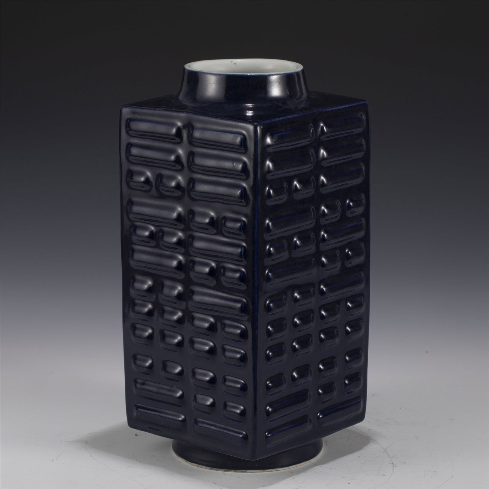 QING QIANLONG JI BLUE CONG VASE: Dimensions: 14cm L x 14cm W x 30.8cm H Chinese Qing Dynasty QianLong Ji Blue Porcelain Cong Vase. Potted in Cong shape vase, thick and tall, squared body, with short circle opening mouth and foot base