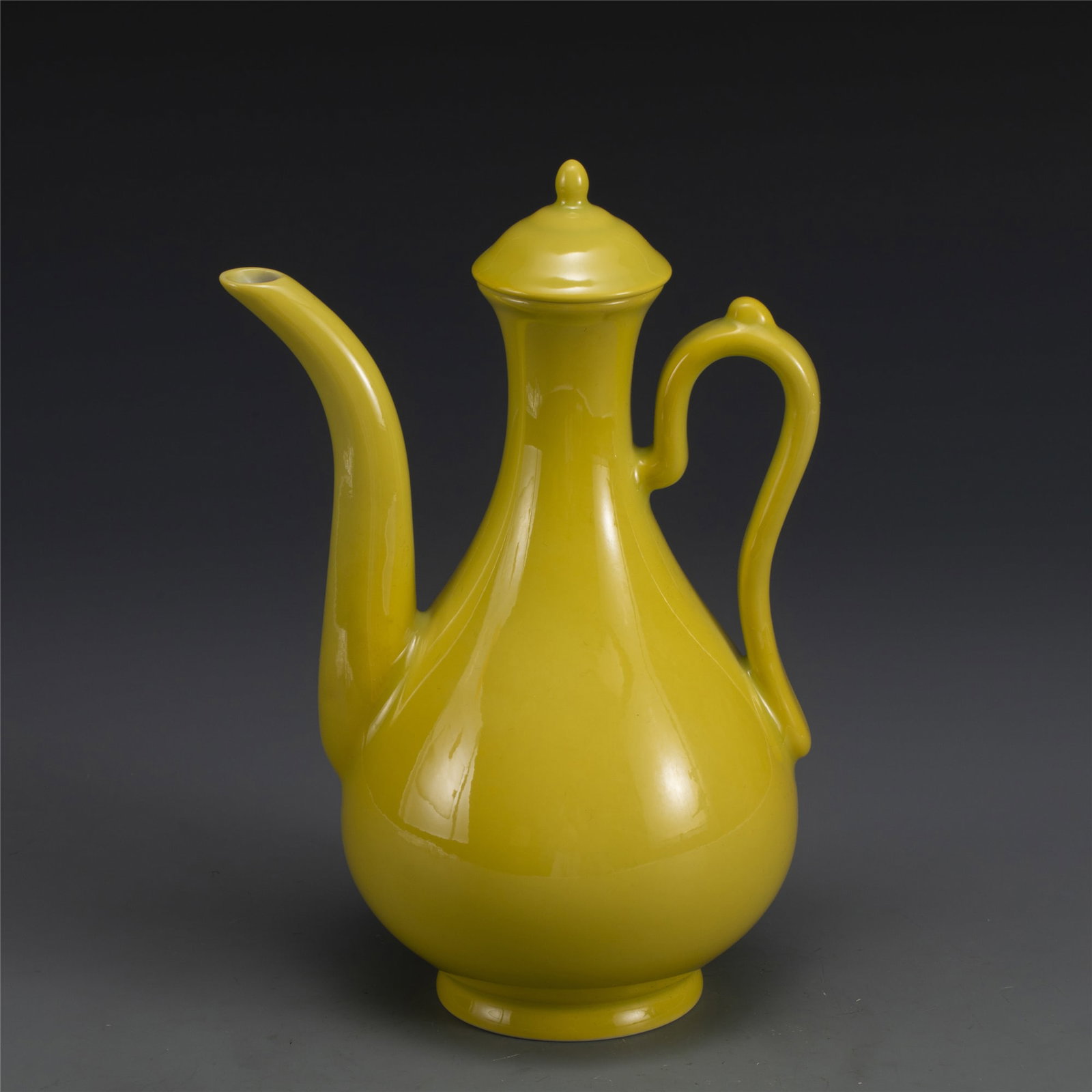 QING YONGZHENG YELLOW GLAZED POT: Dimensions: Length: 16.5cm, Width: 12.5cm, Height: 24cm. Chinese Qing Yongzheng Yellow Glazed Porcelain Wine Pot. Potted in wine pot shape, globular body, short cylindrical neck, with curved spout fla