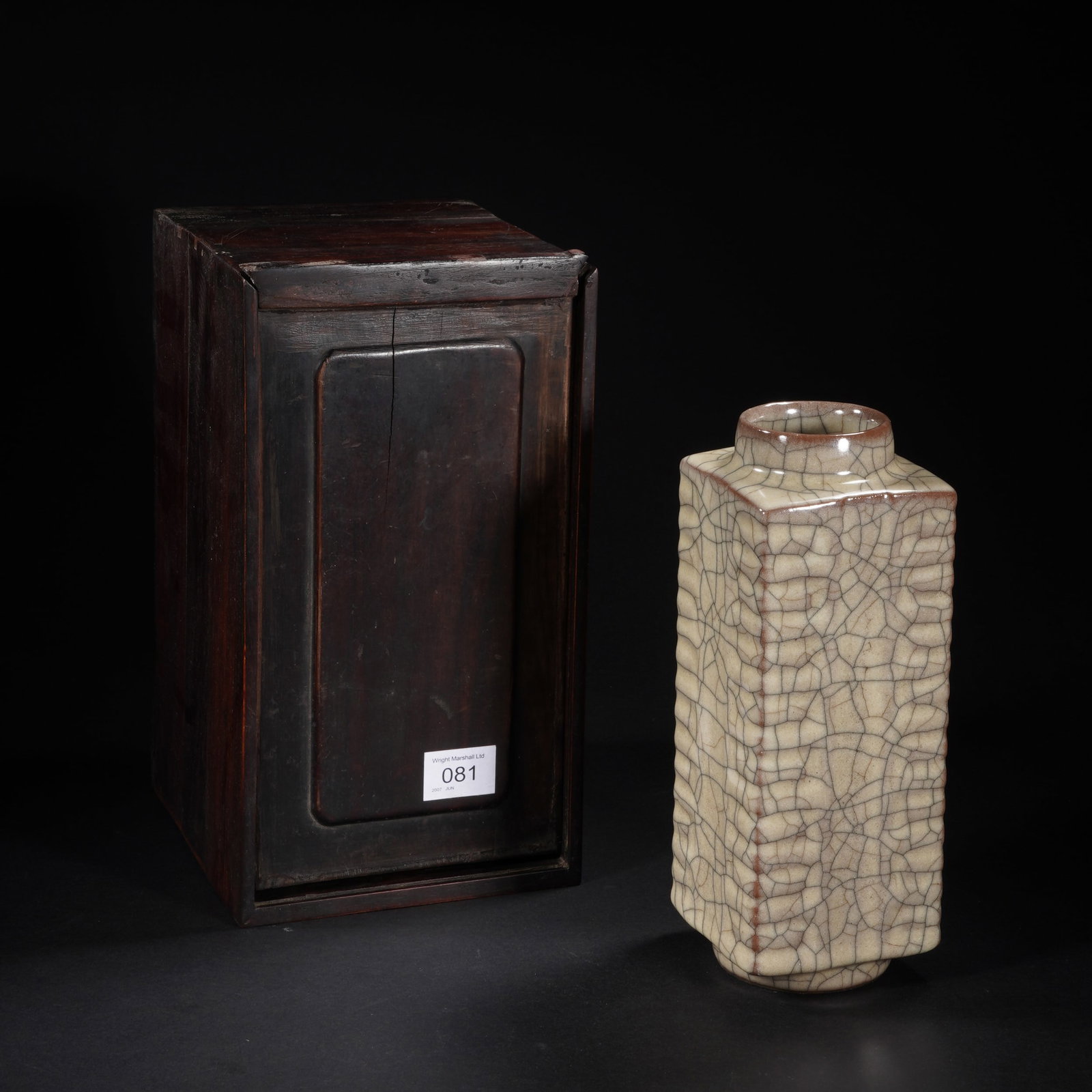 A CHINESE GE-WARE CRACKLE LOZENGE VASE: Dimensions: 8x22 cm. Of lozenge shape, applied overall with pale glaze with fine crackles, with matched wooden box.