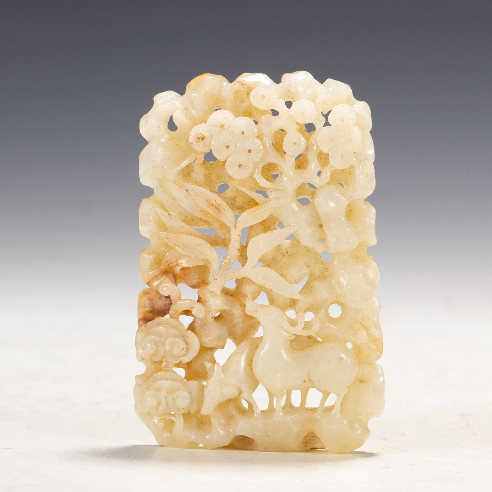 A CHINESE CARVED JADE DEER PLAQUE