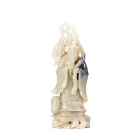 A CARVED WHITE JADE STANDING IMMORTAL